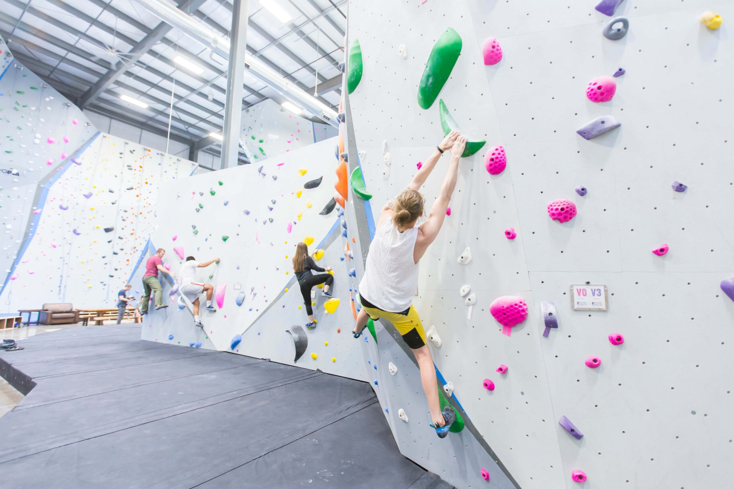 Several climbers are bouldering.
