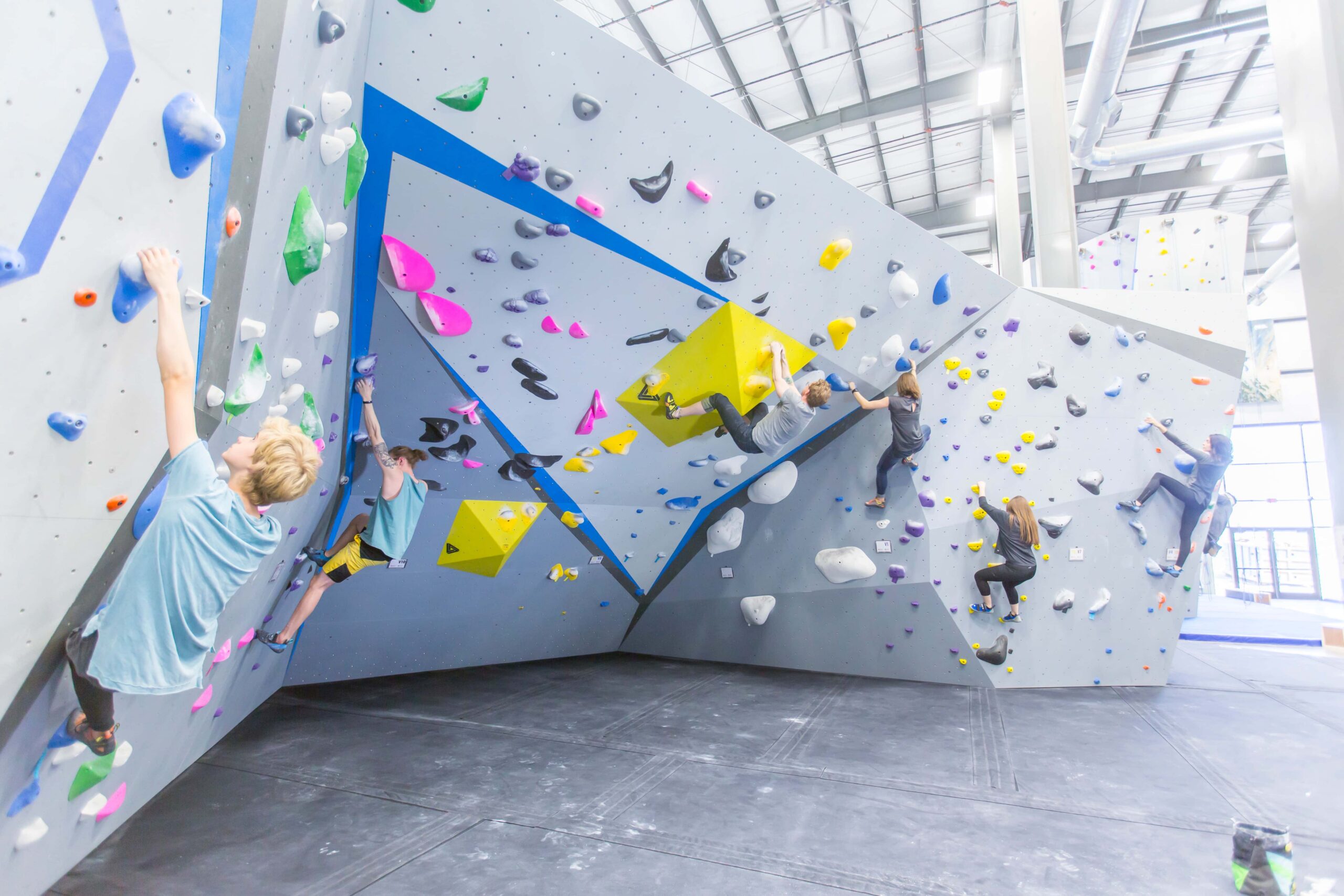 Several climbers are bouldering.
