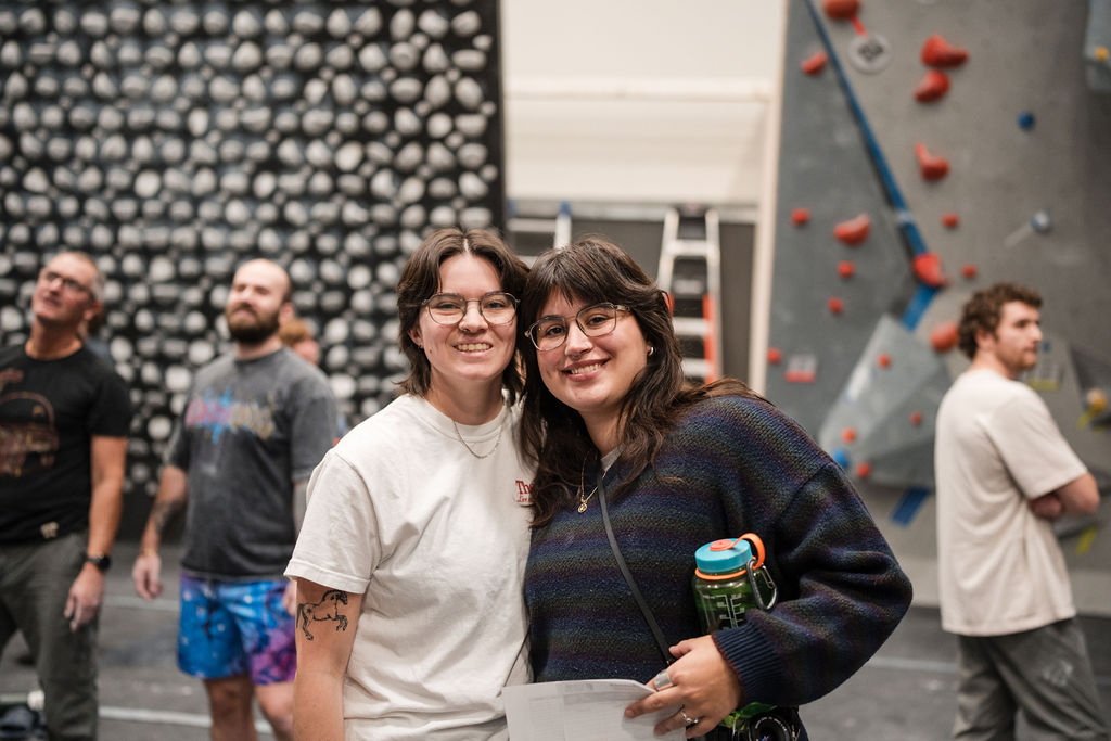 two female clmbers at central rock gym buffalo during a climbing competition