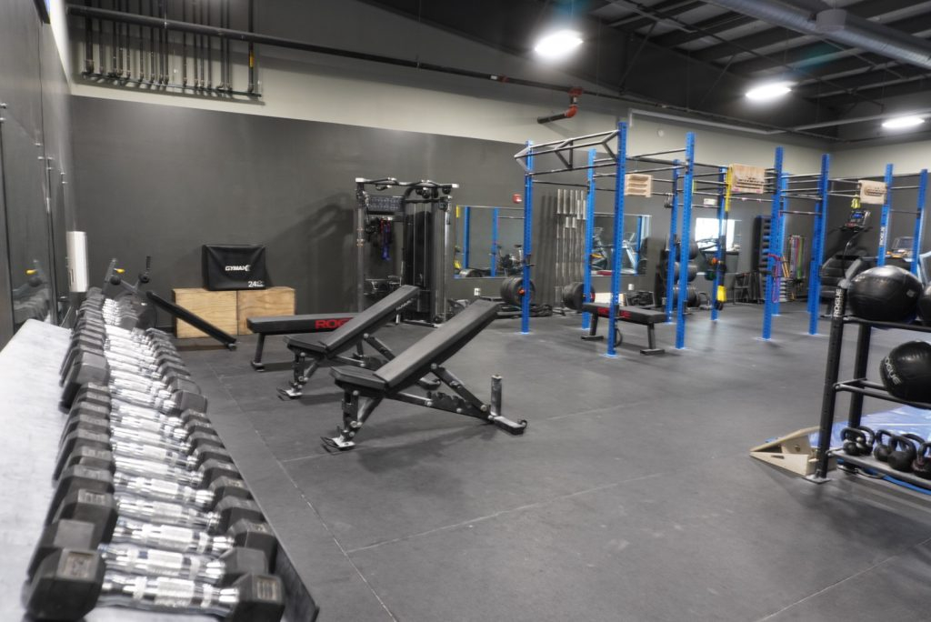 photo of fitness room with weights, benches, racks at crg buffalo