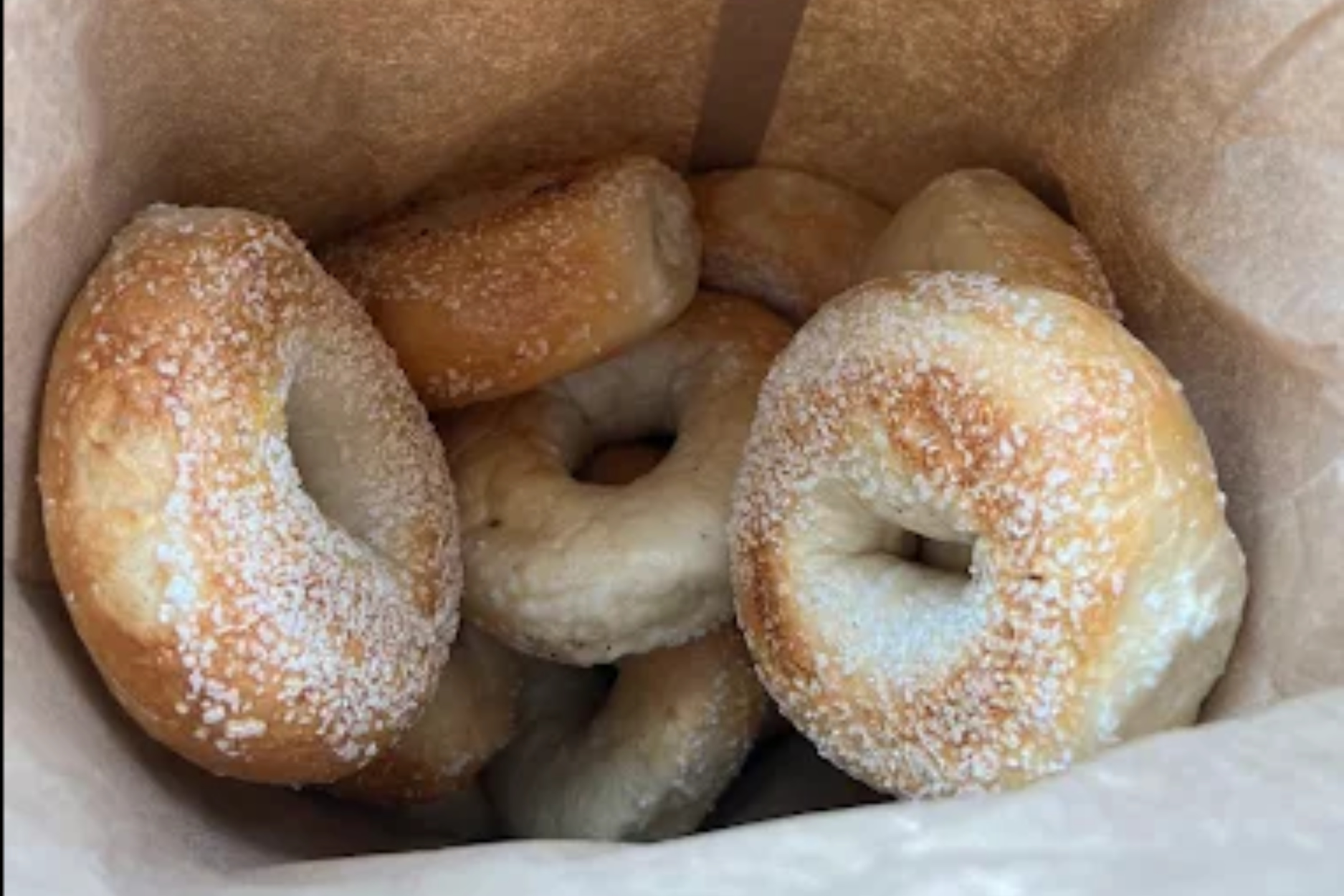 A brown paper bag full of salted bagels for an event at Central Rock Gym.