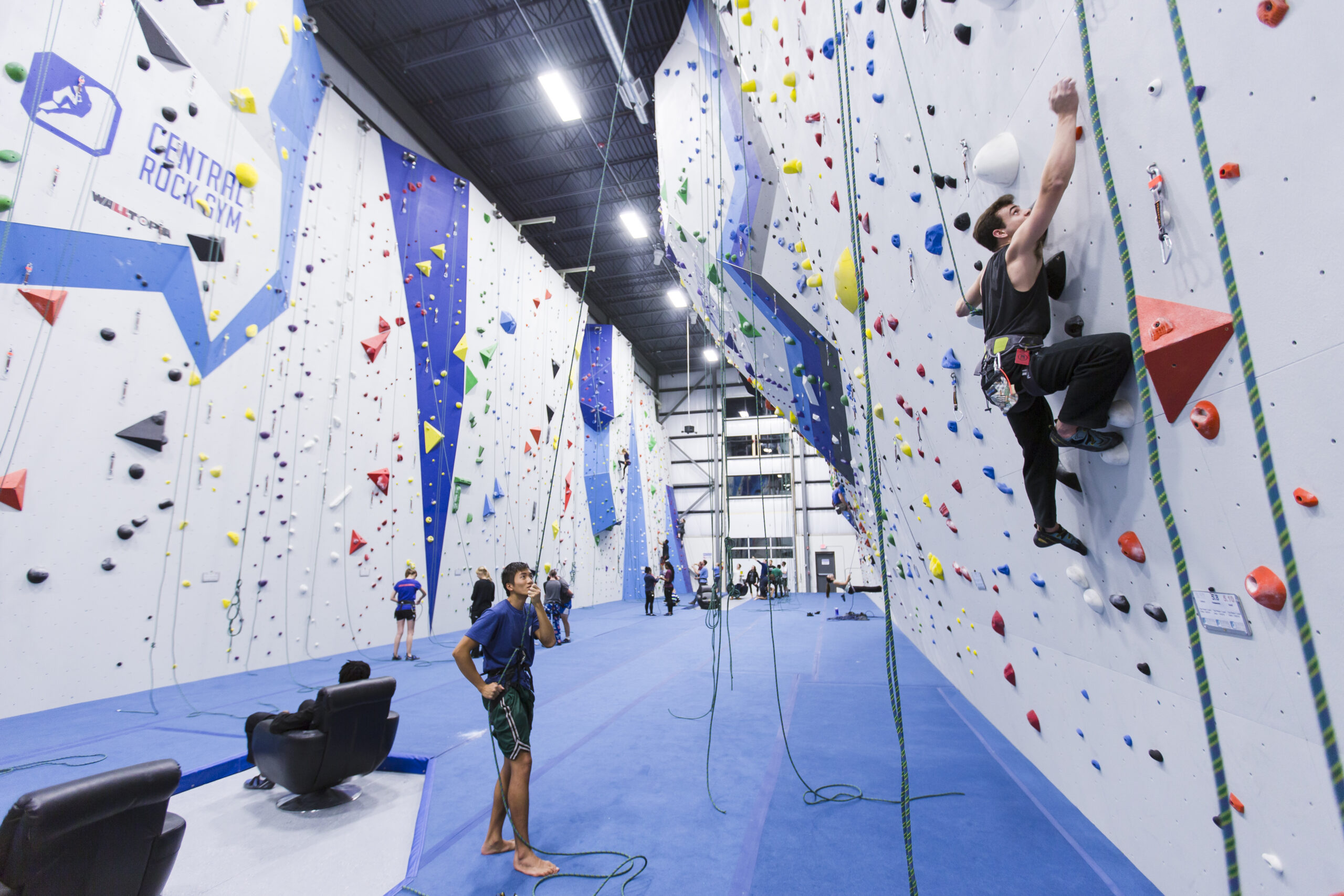 A man top roping while being supported by a instructor at Central Rock Gym Randolph