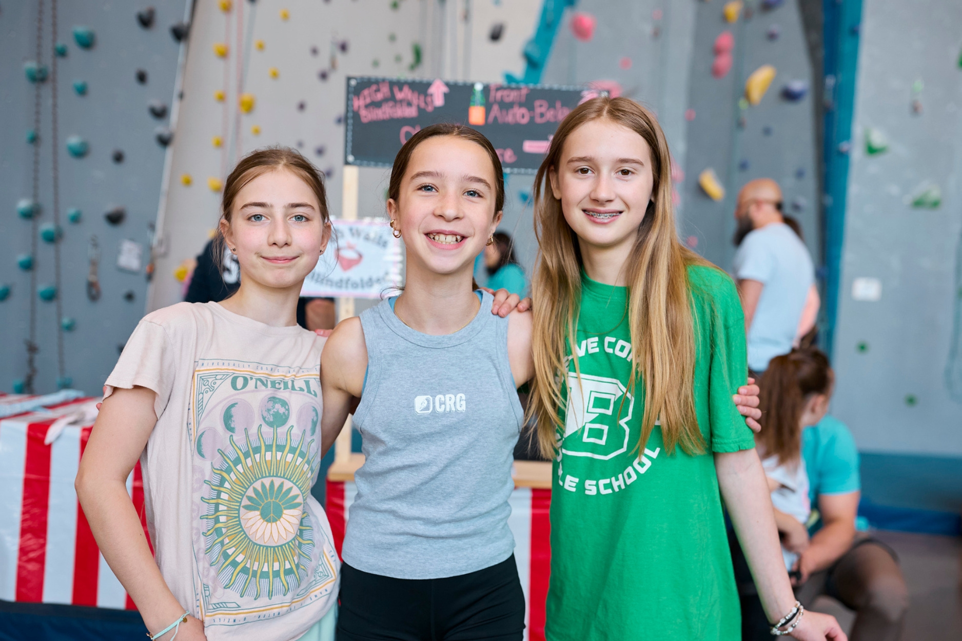 Friends hanging out, posing for a photo during Kids Night Out.