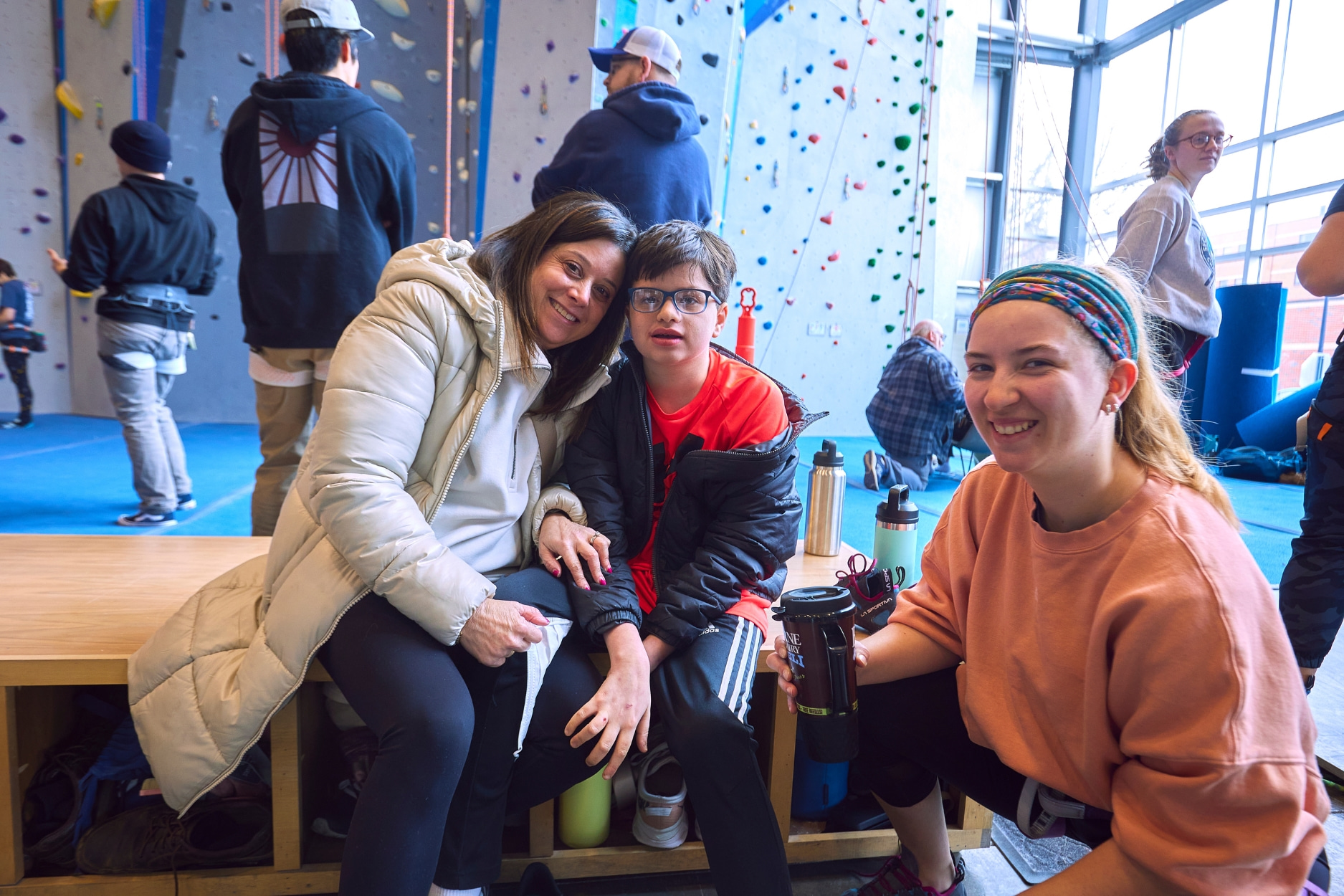 Adaptive climber and family arrive for their climbing session.