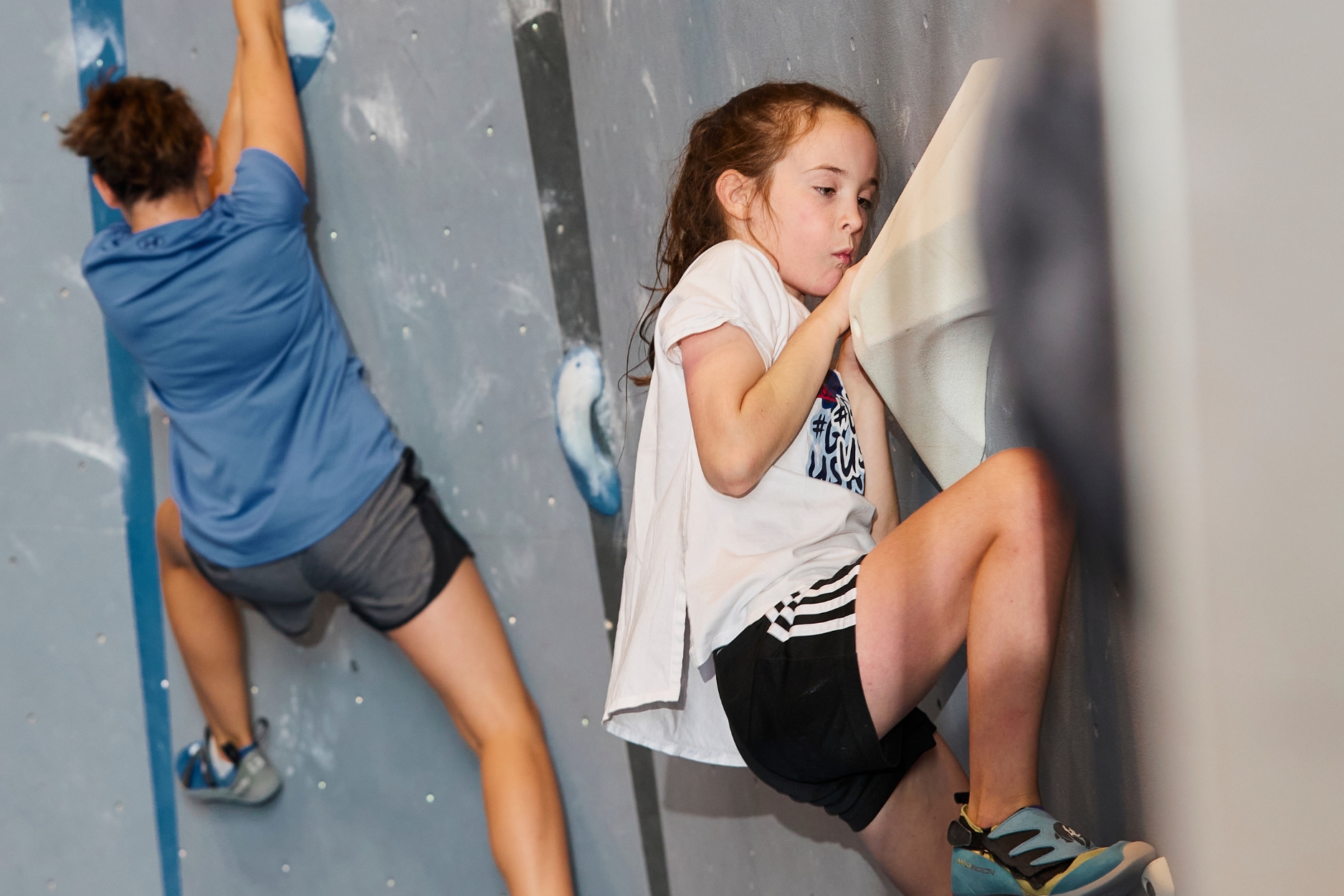Two young climbers bouldering