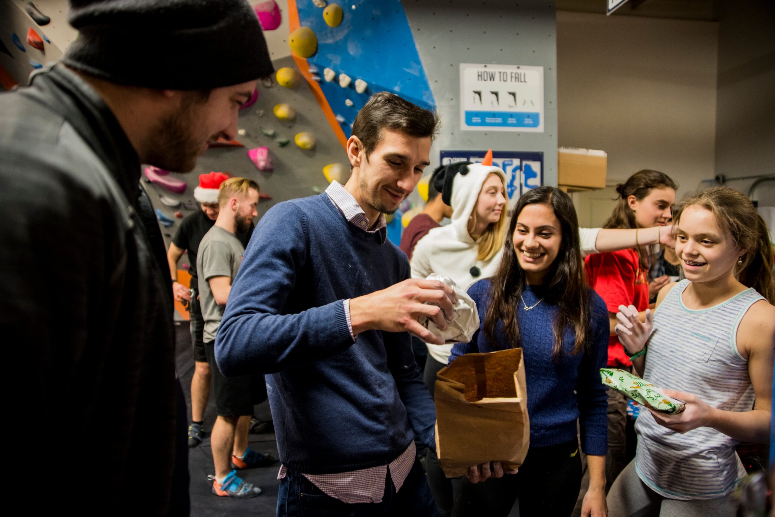 A group of climbers having a party in the climbing gym.