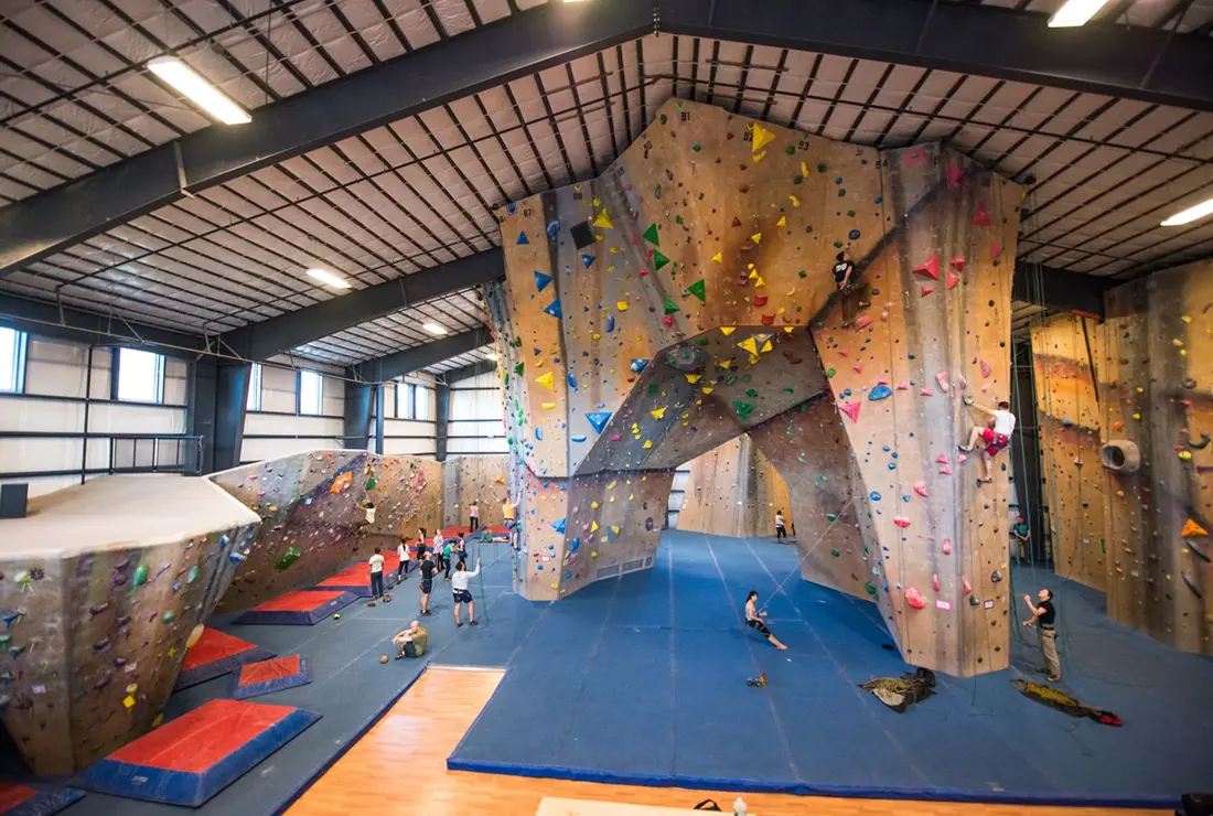 A wide photo taken of the rock walls at Central rock gym