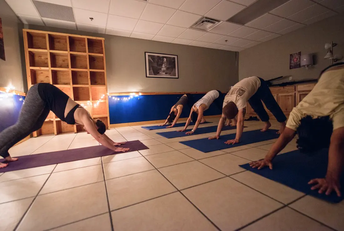 A yoga class being taught at Central rock gym