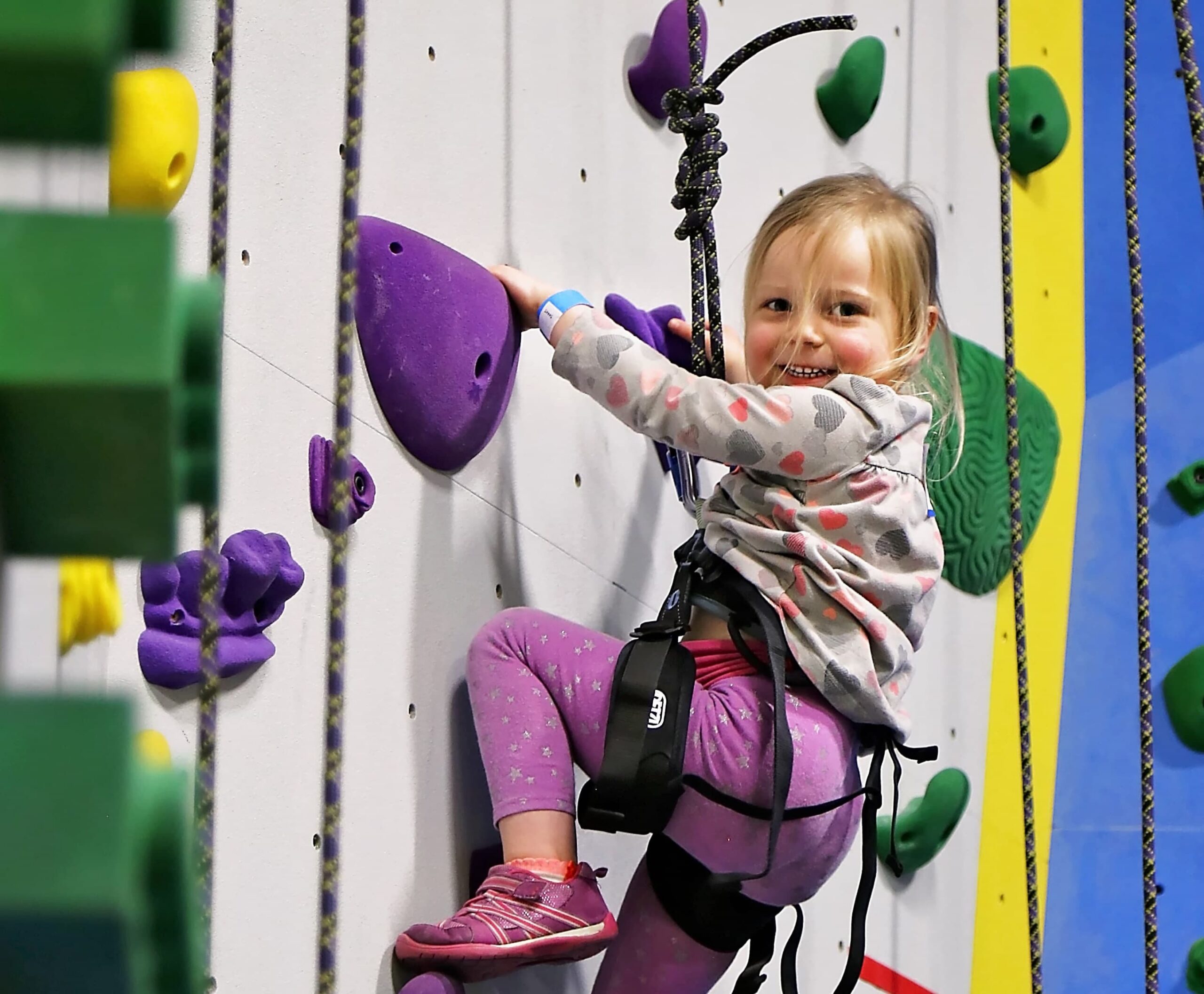 Toddler Climbs on top rope walls.