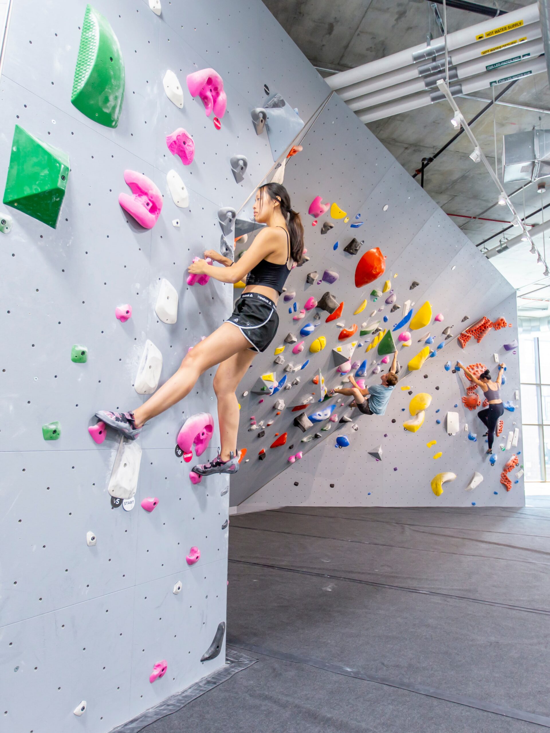 a women Bouldering at Central Rock Gym