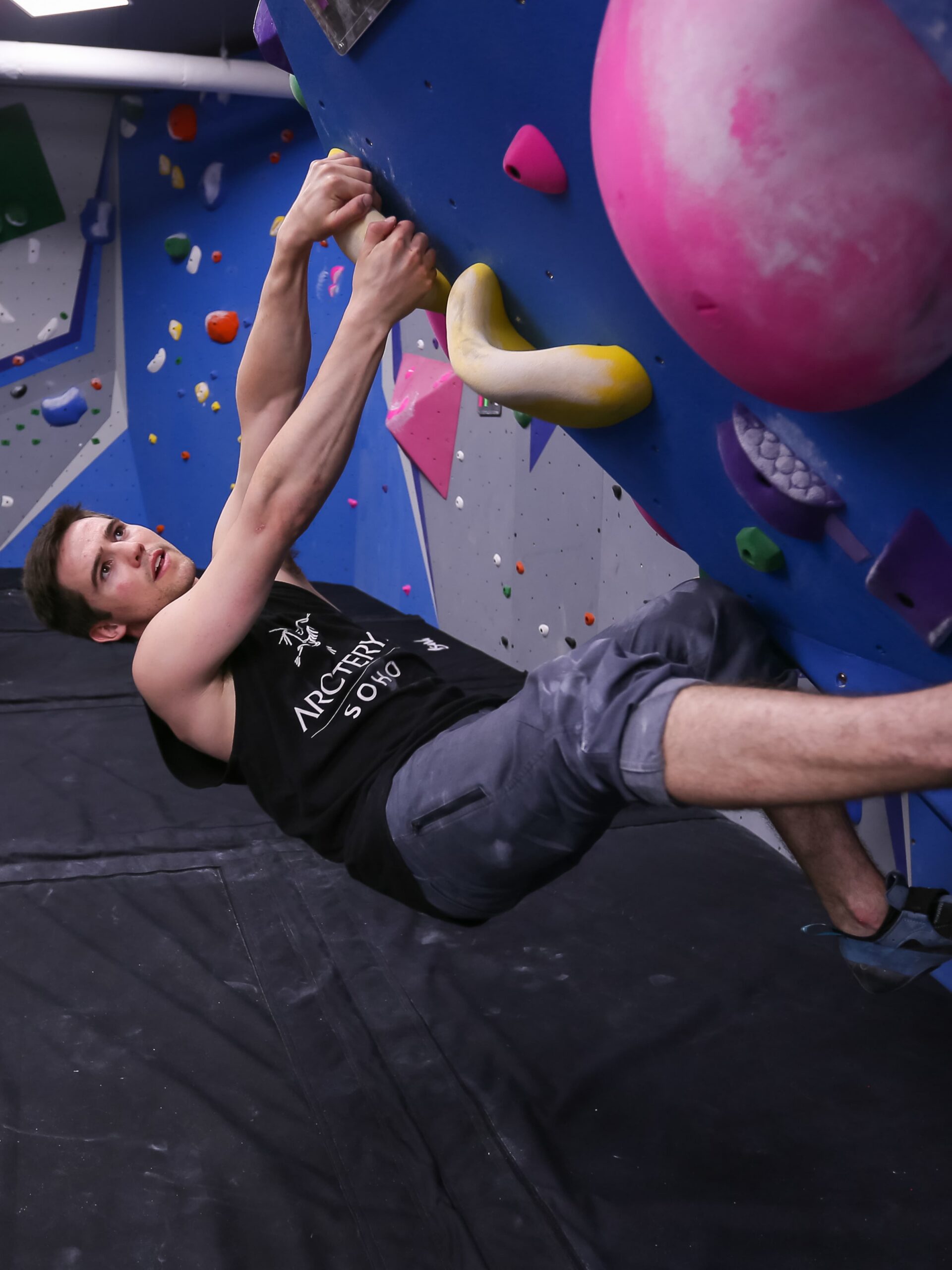 a man bouldering at central rock gym