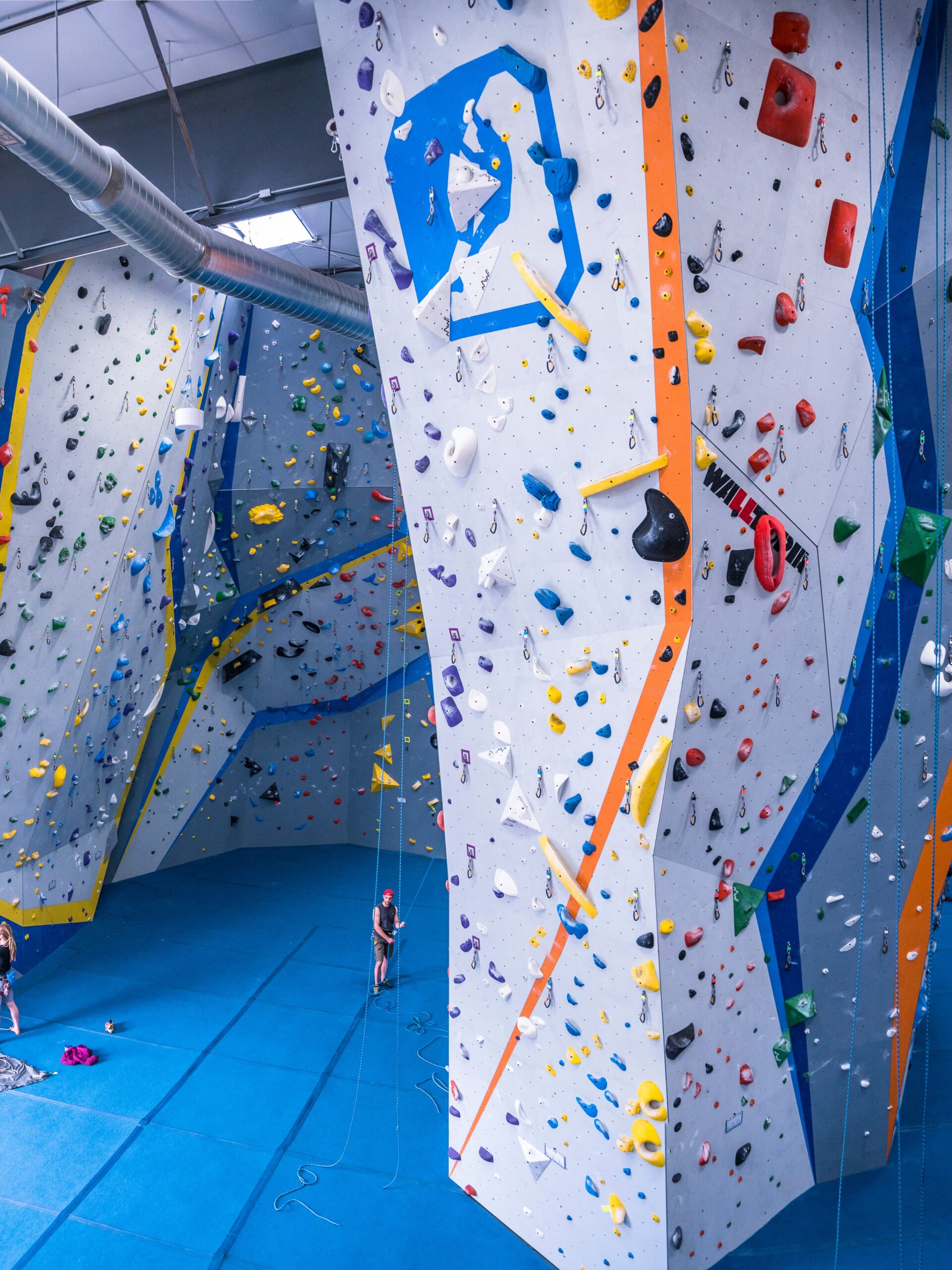 A wide photo showing the rock walls at central rock gym