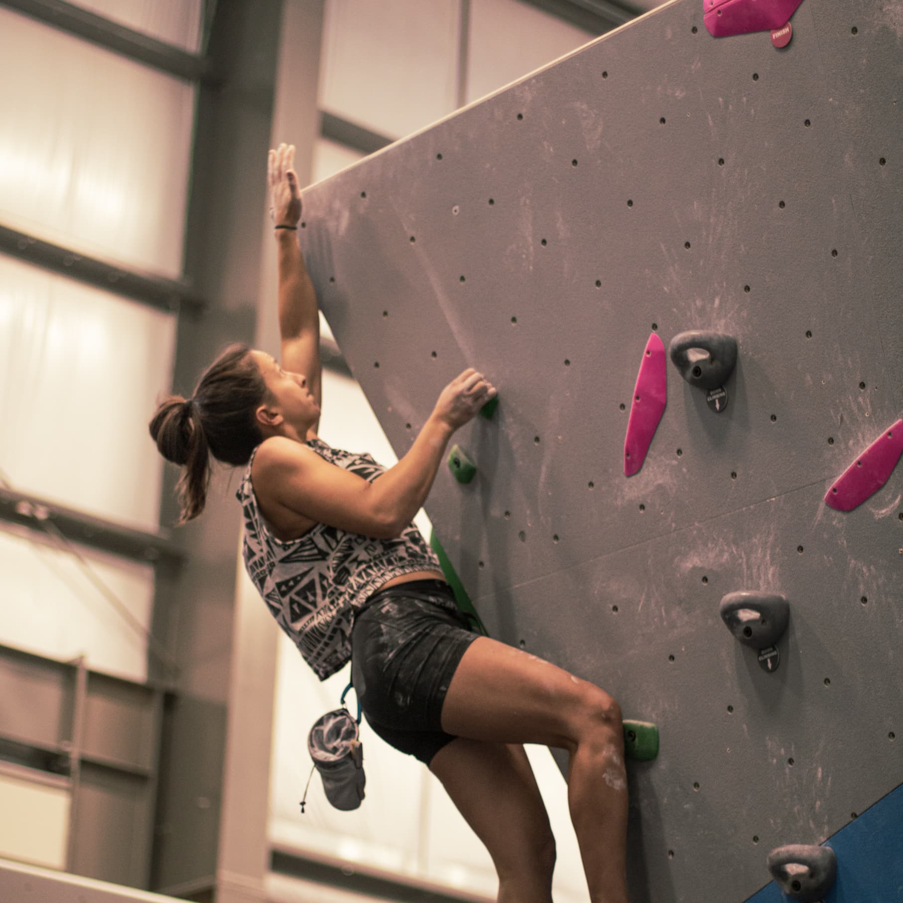 a women bouldering at central rock gym