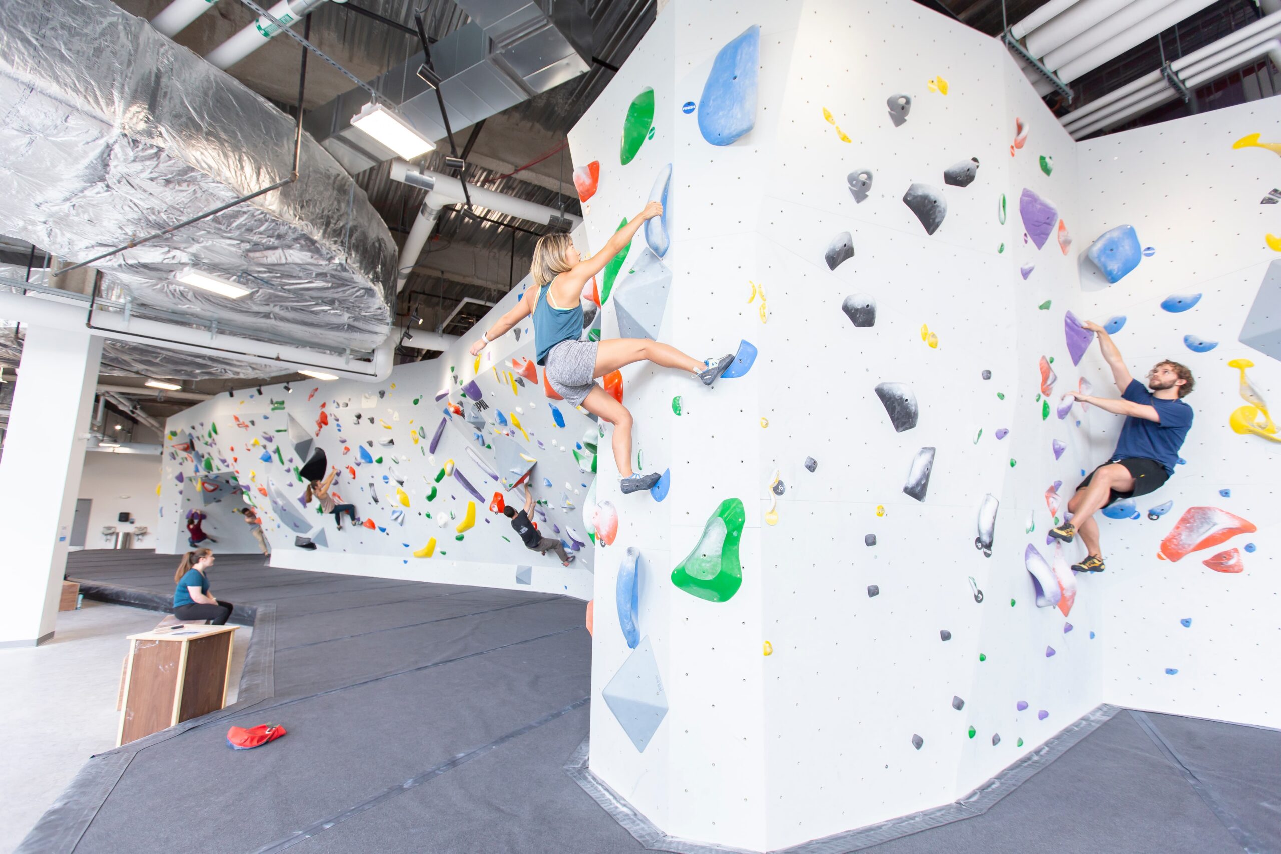 a wide photo of people Bouldering at Central Rock Gym