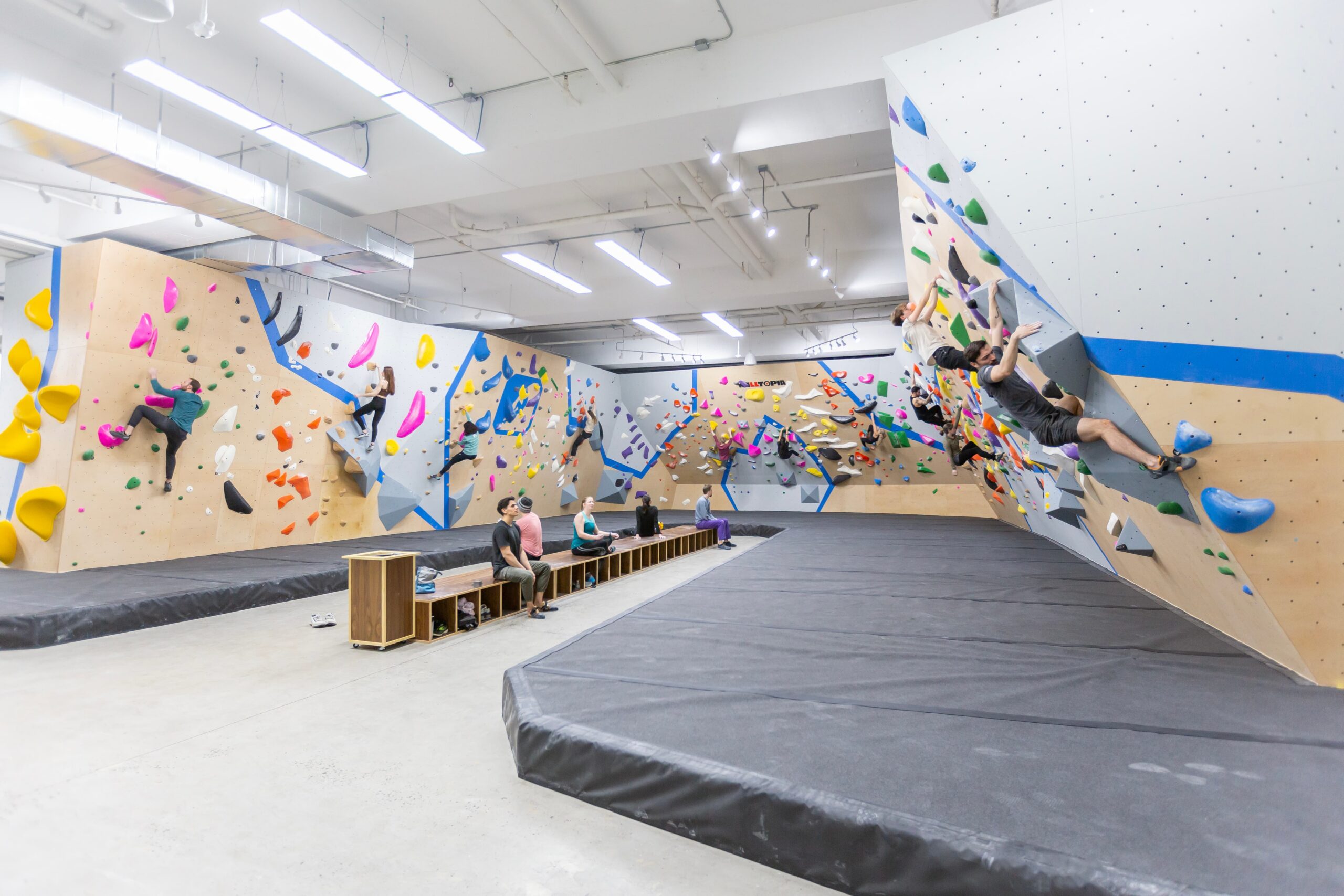 a photo of a group of people bouldering at central rock gym