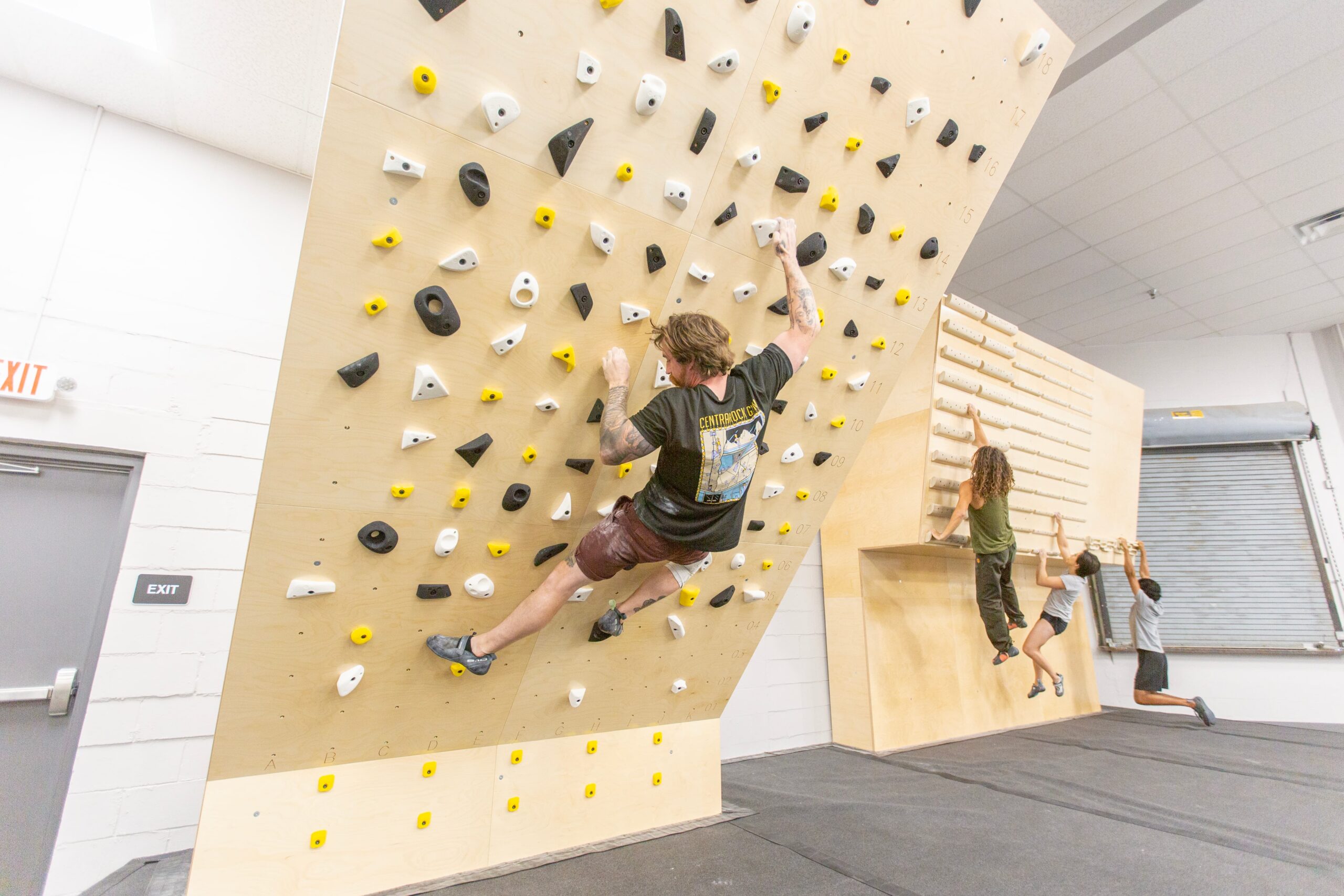 a man is bouldering at central rock gym