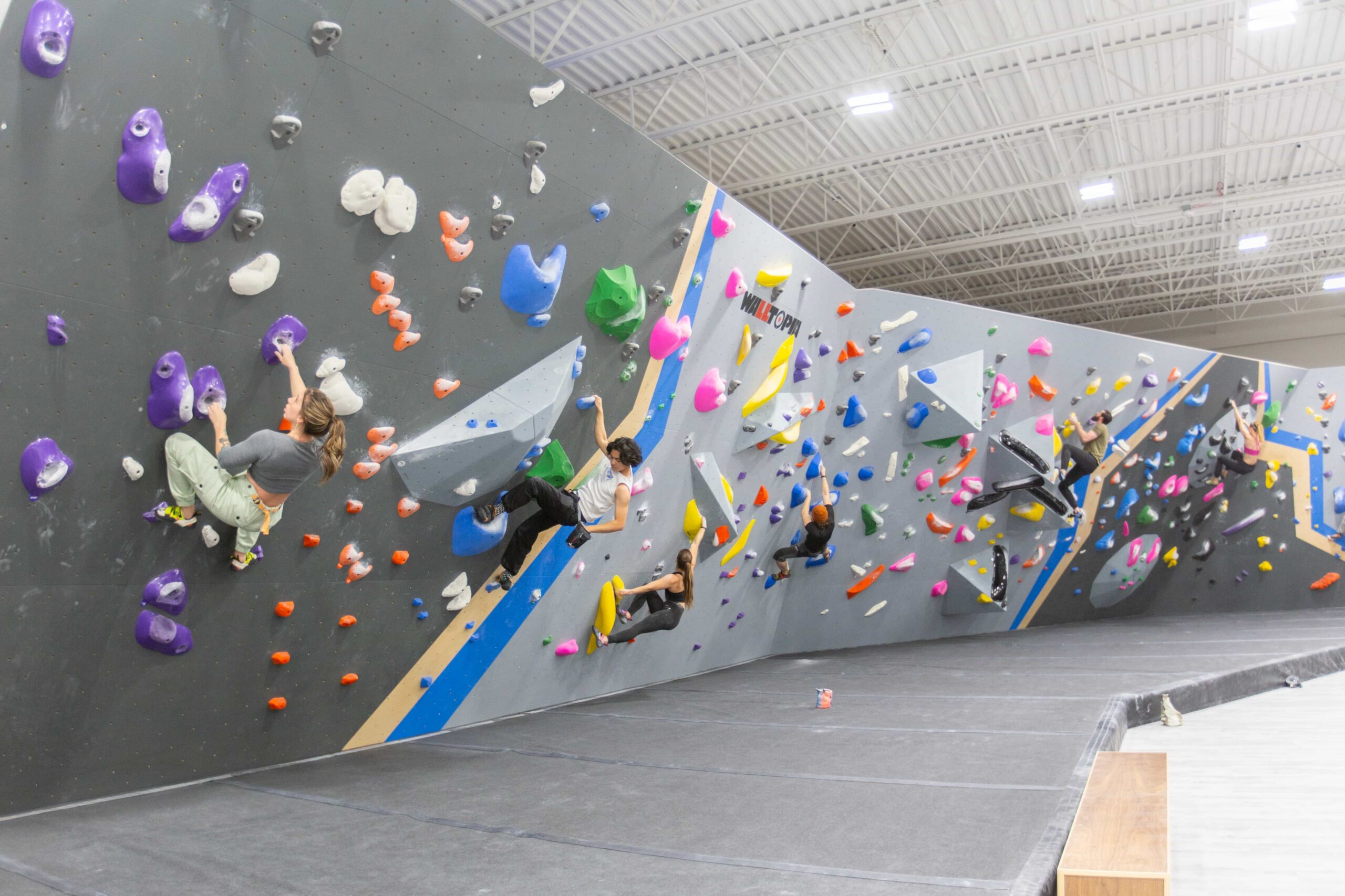 A group of people Bouldering at central rock gym