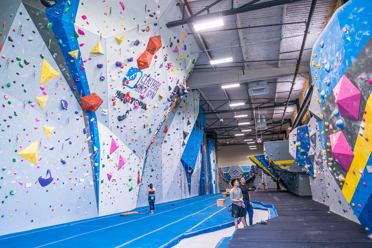 A wide photo of rock walls taken at central rock gym